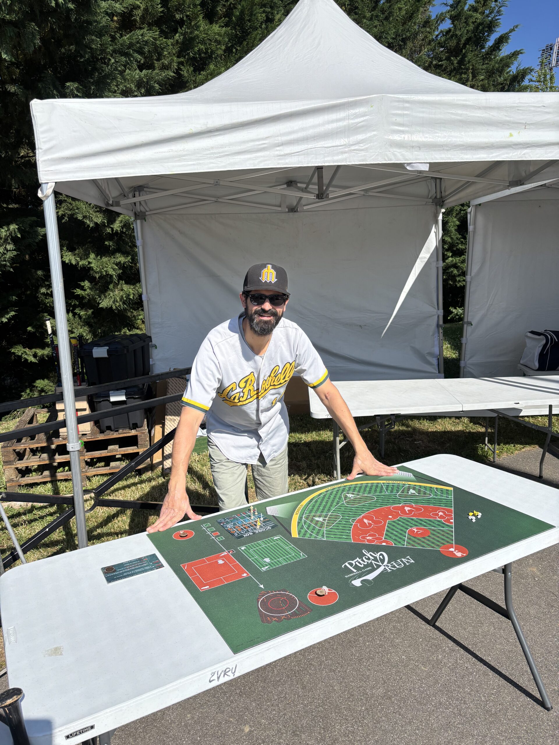 Players in the middle of a game of Pitch N' Run